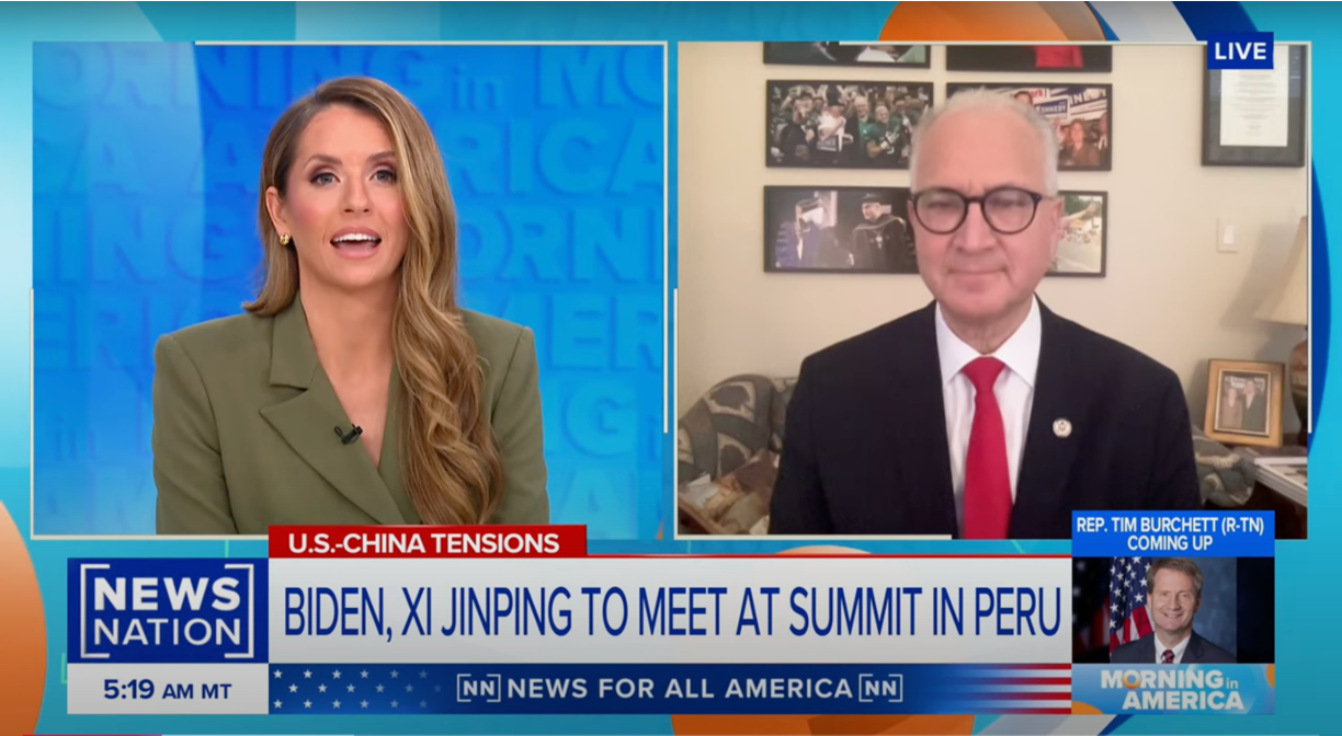A female news anchor speaks with a male guest in a suit and glasses via video call on a NewsNation broadcast. The headline reads: Biden, Xi Jinping to meet at summit in Peru. Graphics and text bars surround the screen.