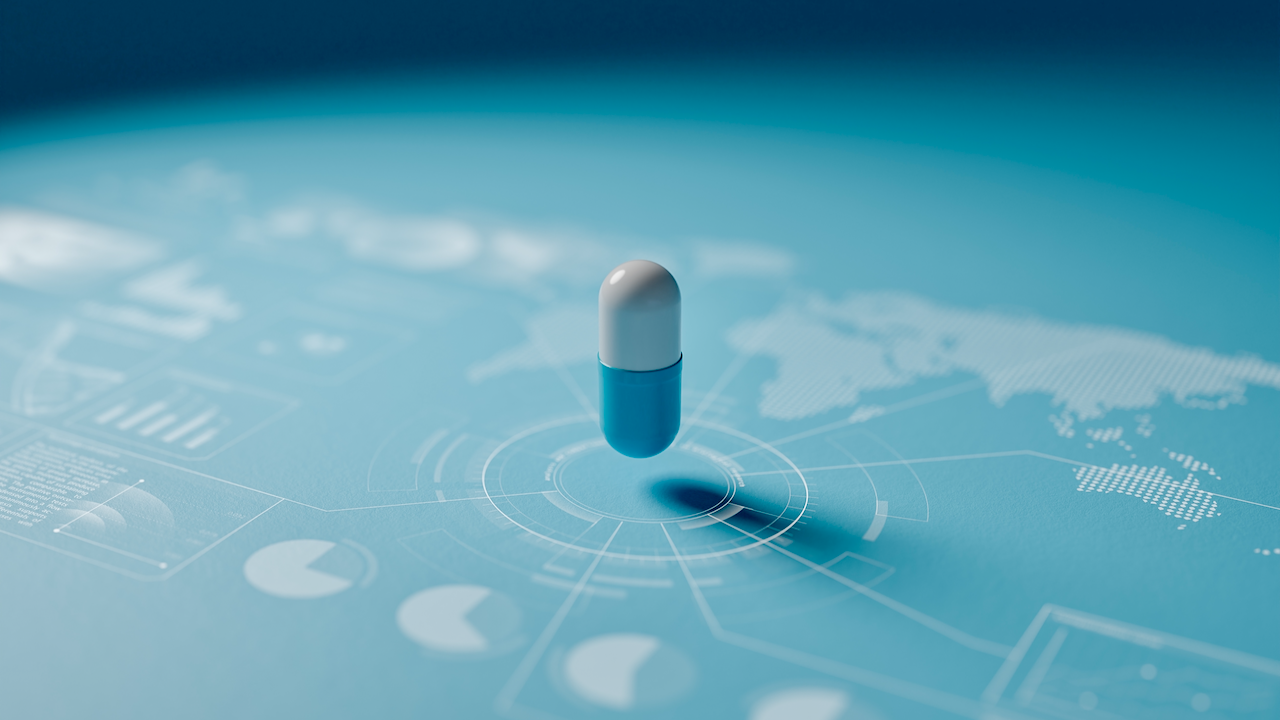 A blue and white capsule pill hovers over a futuristic digital interface with charts, graphs, and a world map, all in blue tones.