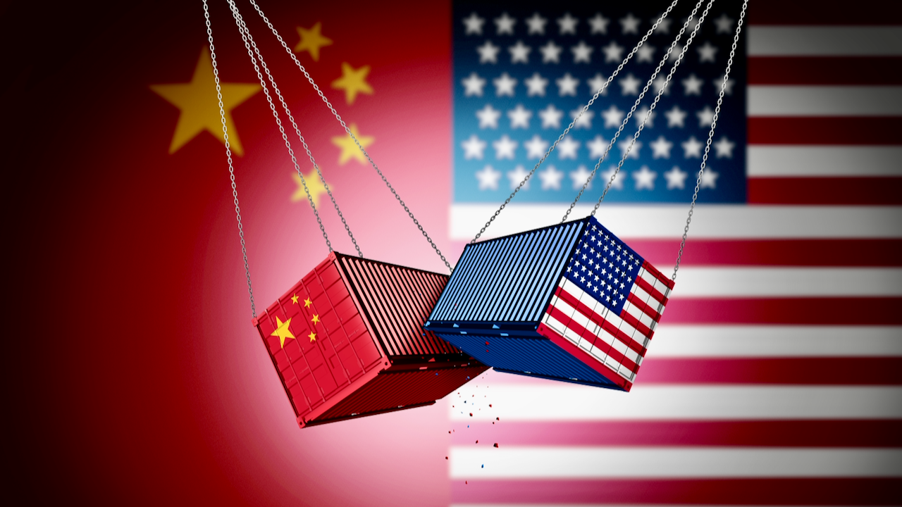 Two shipping containers, one with Chinas flag and the other with the U.S. flag, collide in front of large images of their respective national flags, symbolizing trade conflict between China and the United States.