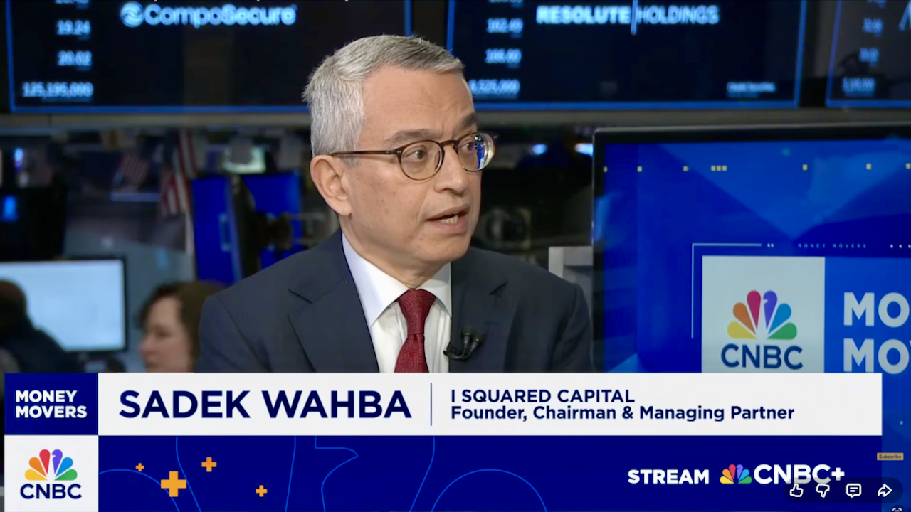 A man wearing glasses and a suit speaks during a CNBC interview. Text on screen reads: SADEK WAHBA | I SQUARED CAPITAL Founder, Chairman & Managing Partner. CNBC and Money Movers logos are visible.