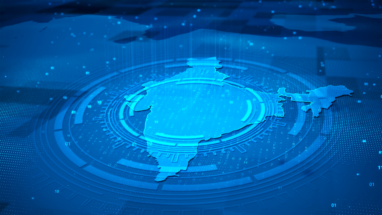 Digital illustration of Indias map in blue tones, surrounded by circular tech and data patterns, representing technology, innovation, or digital transformation in India.