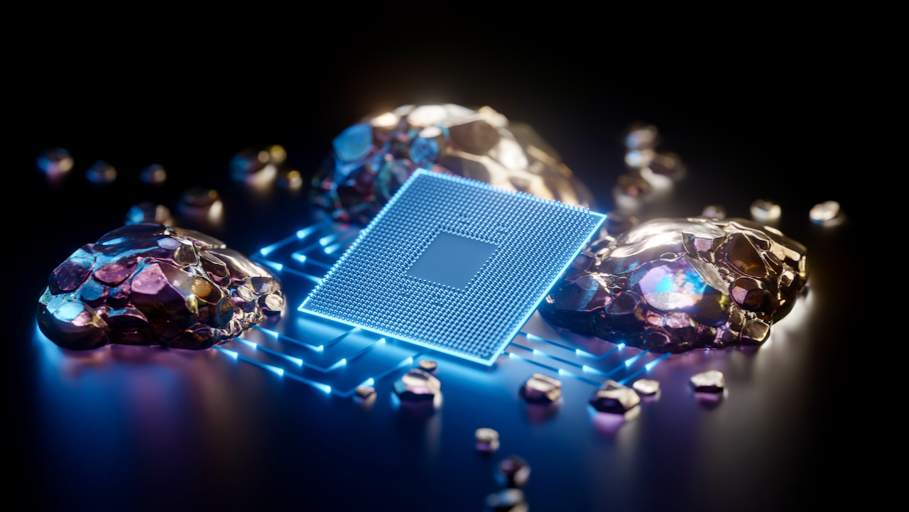 A glowing computer microchip with blue circuitry sits surrounded by metallic, gold-like rocks and nuggets on a dark reflective surface, symbolizing technology and precious resources.
